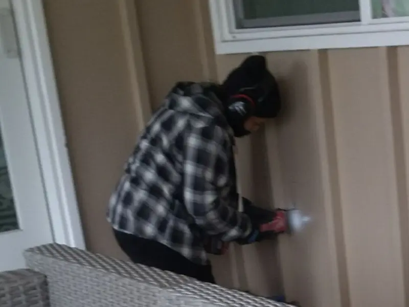 Professional electrician installing an exterior outlet in Angels